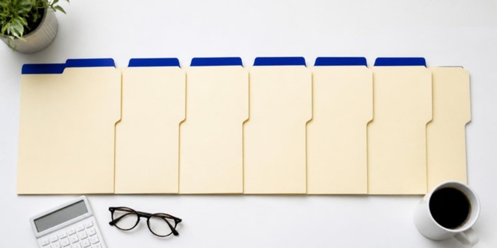 Six file folders, one per unfiled year, organized on a desk